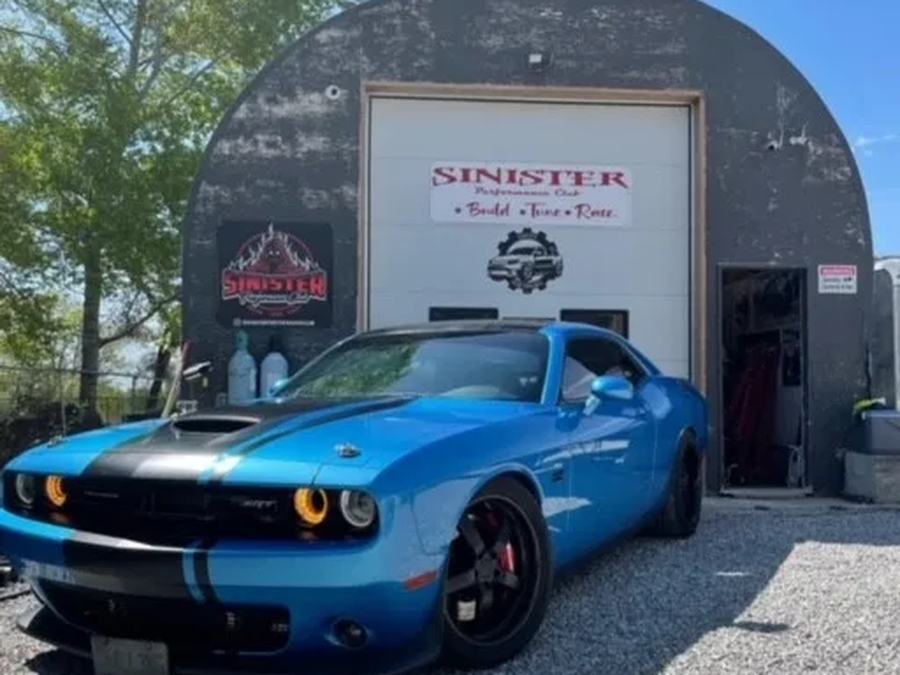 Trevor's blue Challenger Scat Pack outside the shop